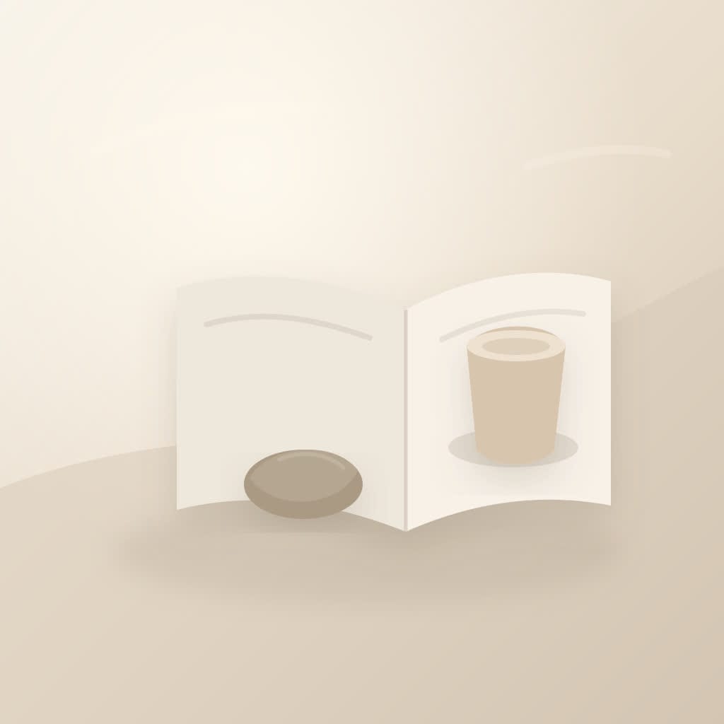 A quiet desk with an open journal, soft morning light, and a small stone beside a cup, suggesting released worry.